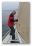 james balancing on the foredeck while doing a very important maneuver with his beer can.